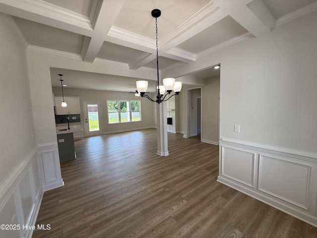 1104 Margaret Ln, Kinston, NC 28501 - unfurnished dining area with coffered ceiling, a chandelier, beamed ceiling, ornamental molding, and dark wood-style floors