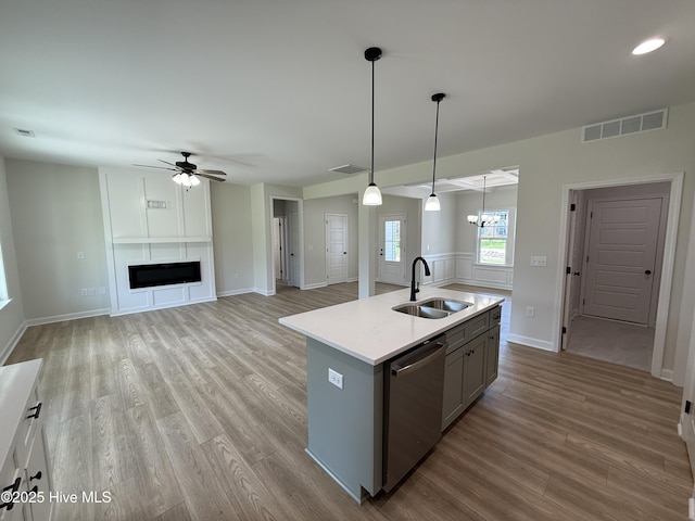 1104 Margaret Ln, Kinston, NC 28501 - kitchen featuring stainless steel dishwasher, a ceiling fan, gray cabinets, wood finished floors, and light countertops