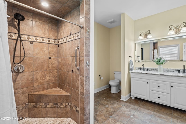 full bathroom with toilet, a tile shower, and double vanity