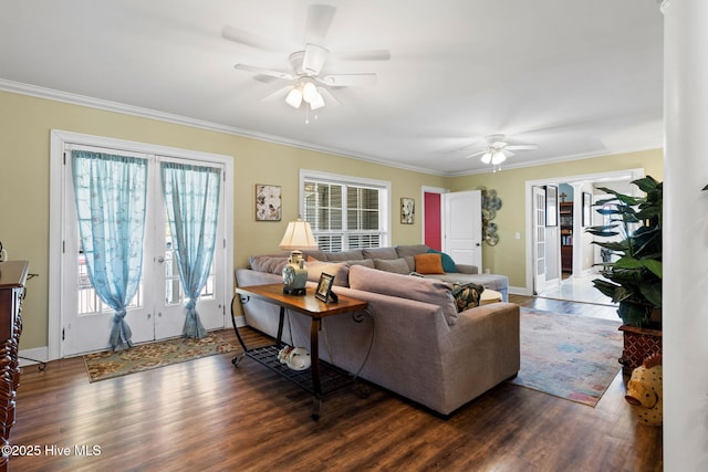 living room featuring crown molding and ceiling fan