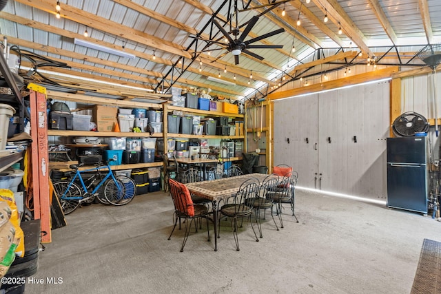 garage with freestanding refrigerator