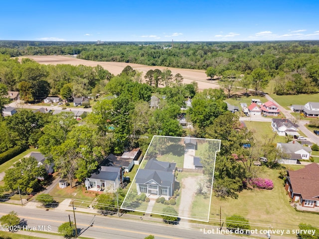 birds eye view of property with a residential view