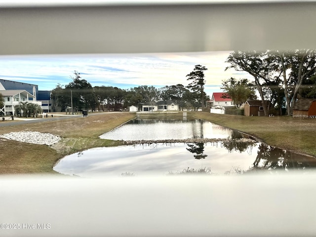 surrounding community with a water view