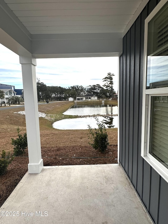 view of patio / terrace with a water view