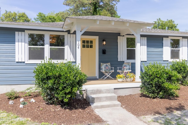 view of front of home featuring a porch and a shingled roof