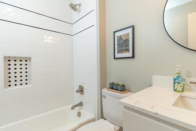 bathroom with toilet, shower / bathtub combination, and vanity