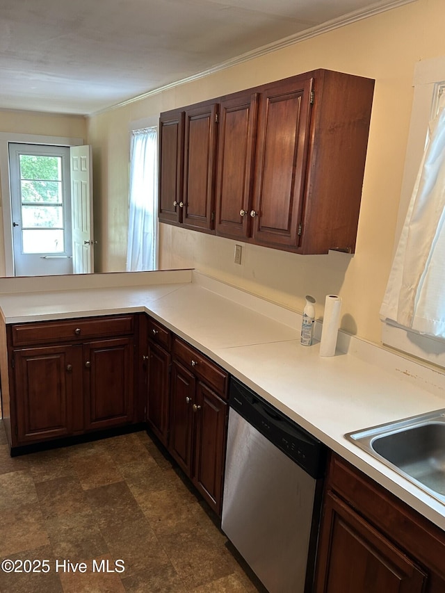 207 E Ashe St, Burgaw, NC 28425 - kitchen with stainless steel dishwasher, light countertops, a sink, a peninsula, and crown molding