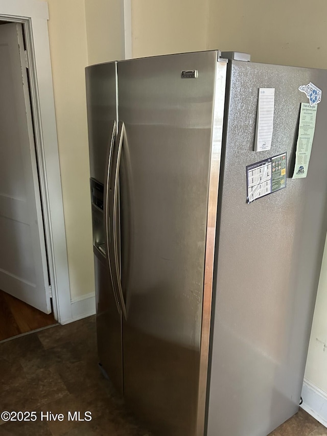 207 E Ashe St, Burgaw, NC 28425 - interior details featuring stainless steel fridge and baseboards