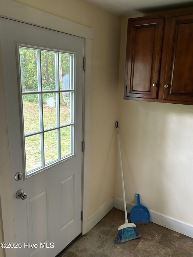 207 E Ashe St, Burgaw, NC 28425 - doorway to outside featuring plenty of natural light and baseboards
