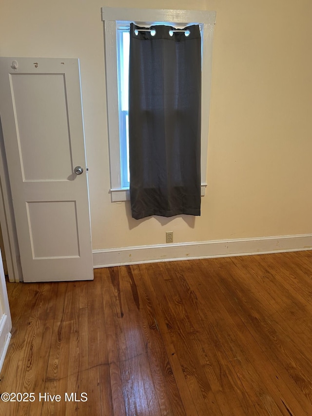 207 E Ashe St, Burgaw, NC 28425 - spare room featuring baseboards and wood finished floors