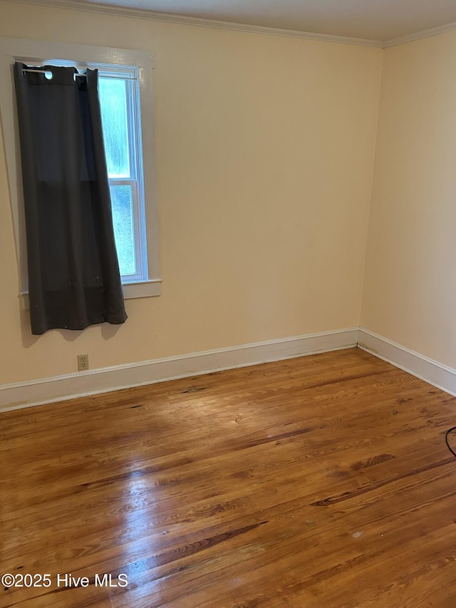 207 E Ashe St, Burgaw, NC 28425 - unfurnished room with ornamental molding, wood finished floors, and baseboards