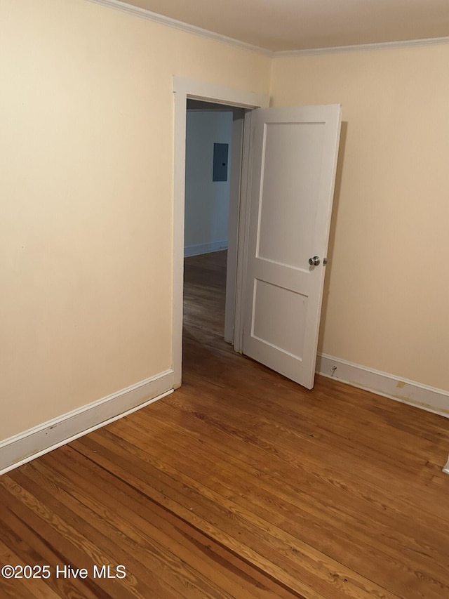 207 E Ashe St, Burgaw, NC 28425 - unfurnished room with baseboards, wood finished floors, and crown molding