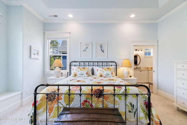 bedroom with light colored carpet, recessed lighting, ornamental molding, ensuite bathroom, and baseboards