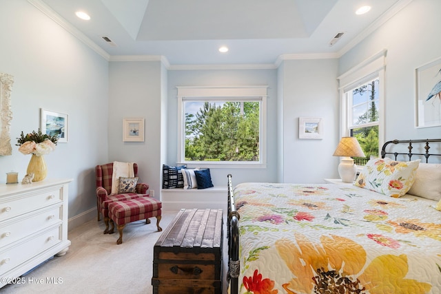 bedroom featuring light colored carpet, a tray ceiling, recessed lighting, baseboards, and crown molding