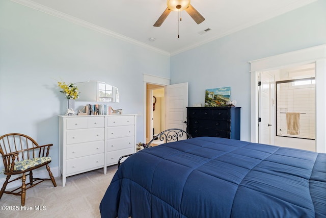 bedroom with carpet floors, crown molding, baseboards, and ensuite bath