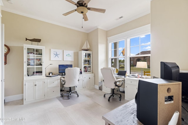 office space with crown molding, ceiling fan, and baseboards
