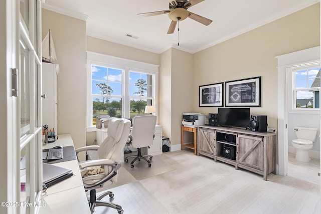 office with a ceiling fan, crown molding, and baseboards