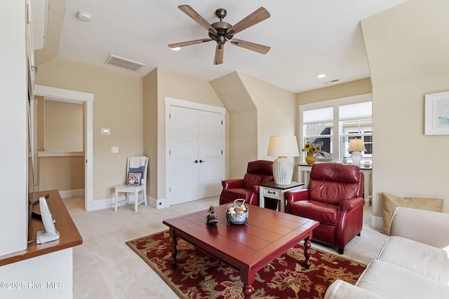 living room featuring light carpet, ceiling fan, baseboards, and recessed lighting