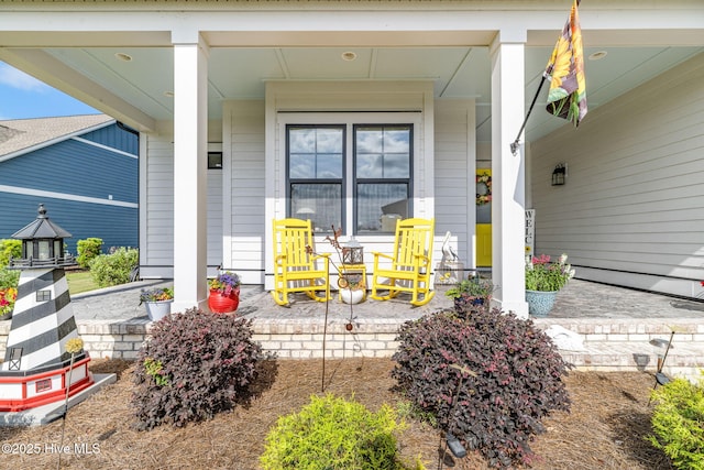 doorway to property with a porch