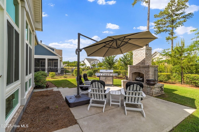 view of patio featuring an outdoor brick fireplace and a grill
