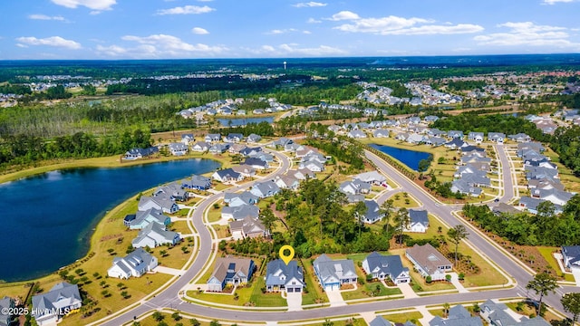 view of property location featuring nearby suburban area and a nearby body of water