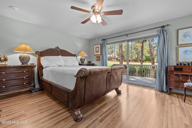 bedroom with access to exterior, light wood finished floors, and a ceiling fan