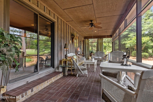 sunroom / solarium with ceiling fan and plenty of natural light