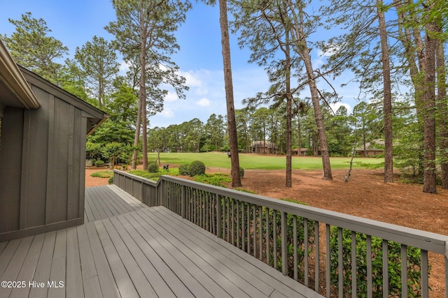 deck featuring view of scattered trees