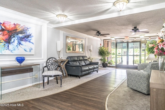 1100 Clarendon St Unit 606, Fayetteville, NC 28305 - living room with crown molding, wood finished floors, a textured ceiling, and a ceiling fan