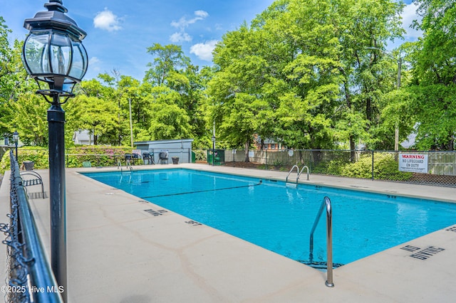 1100 Clarendon St Unit 606, Fayetteville, NC 28305 - community pool featuring view of scattered trees and a patio
