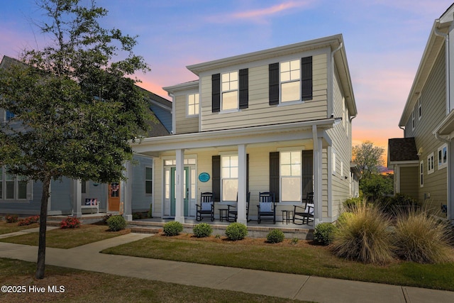 traditional-style house featuring a porch
