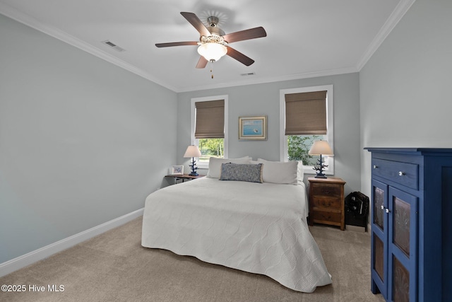 carpeted bedroom featuring baseboards, visible vents, ornamental molding, and ceiling fan