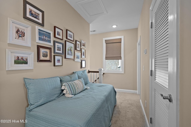 bedroom featuring carpet flooring, baseboards, visible vents, and attic access