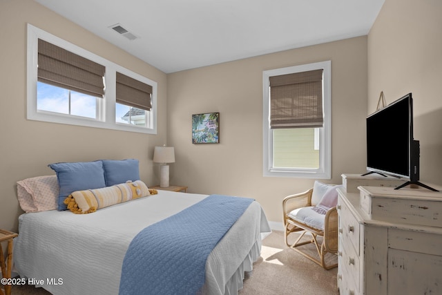 bedroom featuring carpet and visible vents