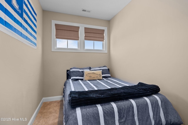 bedroom with visible vents, carpet flooring, and baseboards