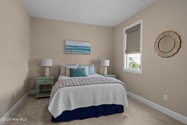 bedroom featuring baseboards and carpet flooring