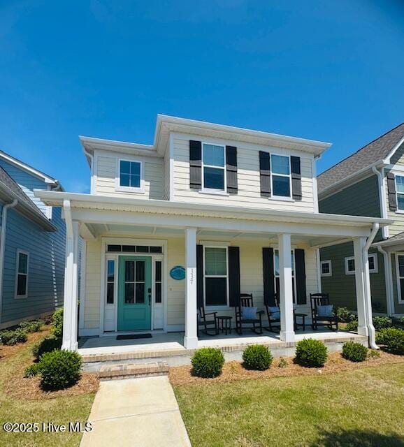 view of front facade with a porch and a front yard