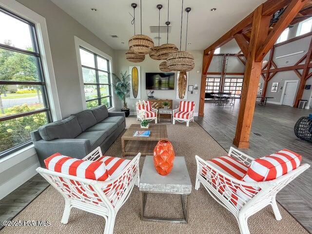 interior space featuring baseboards and wood finished floors