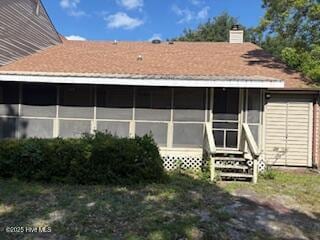 3443 Regency Dr, Wilmington, NC 28412 - rear view of house featuring a chimney, entry steps, and a sunroom