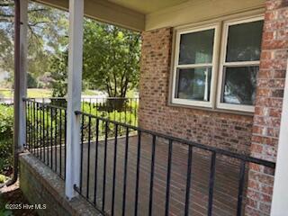 3443 Regency Dr, Wilmington, NC 28412 - spare room featuring healthy amount of natural light, a ceiling fan, and dark wood finished floors