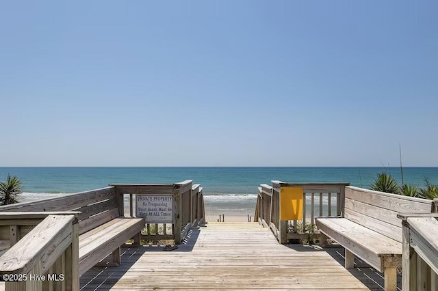 view of community featuring a view of the beach and a water view