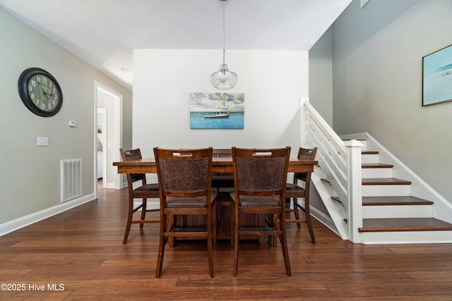 61 Spinnaker Point Rd N, Oriental, NC 28571 - dining area featuring wood-type flooring, baseboards, and stairway