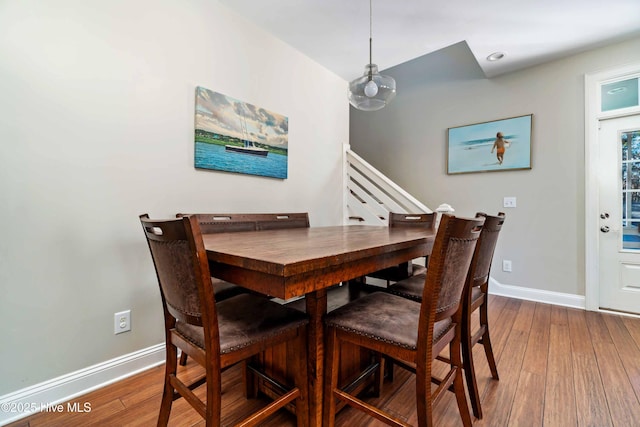 61 Spinnaker Point Rd N, Oriental, NC 28571 - dining room with hardwood / wood-style floors, baseboards, and stairs