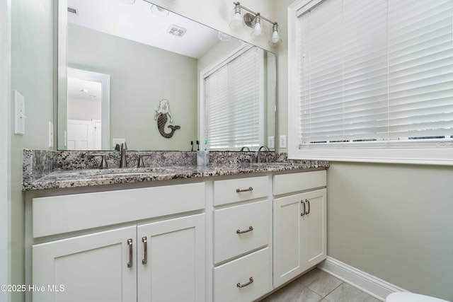 61 Spinnaker Point Rd N, Oriental, NC 28571 - full bathroom with double vanity, tile patterned flooring, and baseboards