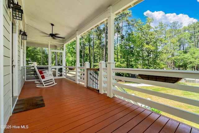 61 Spinnaker Point Rd N, Oriental, NC 28571 - deck with a ceiling fan, covered porch, and view of scattered trees
