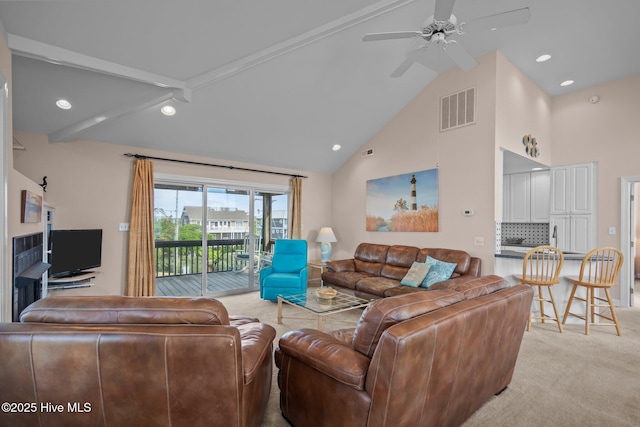 living room with light carpet, high vaulted ceiling, ceiling fan, and recessed lighting