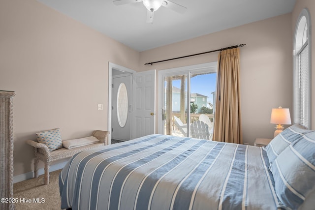 carpeted bedroom featuring access to exterior, a ceiling fan, and baseboards