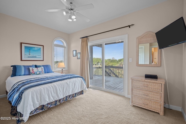 bedroom with access to exterior, baseboards, carpet floors, and a ceiling fan