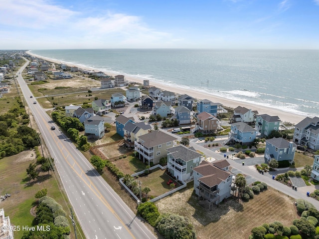 aerial view of residential area with expansive coastline