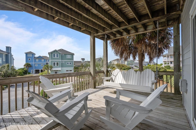 wooden deck featuring a residential view